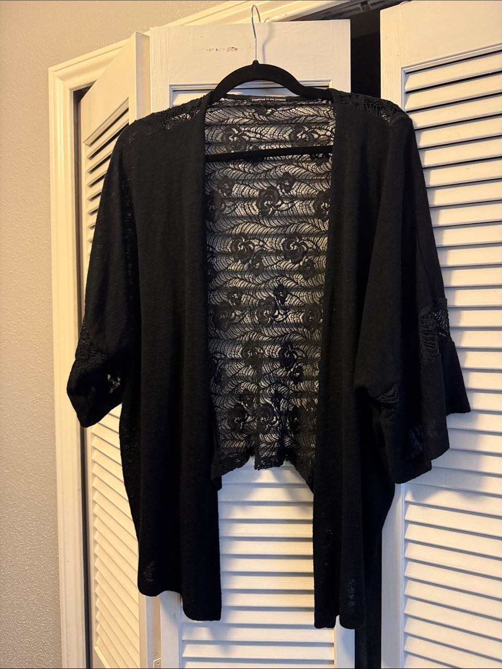 happening in the present Black Lace-Back Open-Front Cardigan